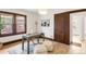 Bright home office with a large window, hardwood floors, and a decorative area rug at 3361 W 36Th Ave, Denver, CO 80211