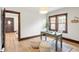 Home office featuring hardwood floors, area rug, lots of sunlight, and decorative poufs at 3361 W 36Th Ave, Denver, CO 80211