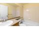 Bathroom featuring large mirror, vanity, and combined shower and tub at 6760 E 129Th Ave, Thornton, CO 80602