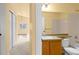 Bathroom featuring large mirror, vanity, and combined shower and tub at 6760 E 129Th Ave, Thornton, CO 80602