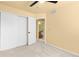 Bright bedroom featuring neutral carpet and an en suite bathroom and closet at 6760 E 129Th Ave, Thornton, CO 80602