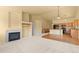 Spacious living room with a fireplace, bright lighting, and an open floor plan at 6760 E 129Th Ave, Thornton, CO 80602