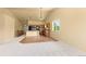 Living room, and kitchen view with a combination of carpet and hardwood flooring at 6760 E 129Th Ave, Thornton, CO 80602