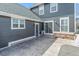 Spacious backyard patio with sliding glass door and stone accents, great for outdoor relaxation at 5140 Mt Pawnee Ave, Frederick, CO 80504