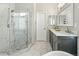 Spacious bathroom features large walk-in shower with glass door and marble tiling at 5140 Mt Pawnee Ave, Frederick, CO 80504