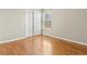 Bedroom with hardwood floors, large closet, neutral paint, and natural light at 5140 Mt Pawnee Ave, Frederick, CO 80504