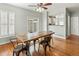 Bright dining room with hardwood floors and sliding door access at 5140 Mt Pawnee Ave, Frederick, CO 80504