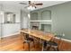 Open-concept dining room with hardwood floors and fireplace at 5140 Mt Pawnee Ave, Frederick, CO 80504