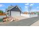 Home with garage, driveway, and a well-maintained fence, with convenient access to the backyard at 5140 Mt Pawnee Ave, Frederick, CO 80504