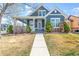 Charming two-story home with a cozy front porch, manicured lawn, and well-maintained landscaping at 5140 Mt Pawnee Ave, Frederick, CO 80504