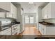 Bright kitchen features granite countertops, stainless steel appliances, and hardwood floors at 5140 Mt Pawnee Ave, Frederick, CO 80504