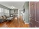 Cozy living room with a fireplace and beautiful hardwood floors at 5140 Mt Pawnee Ave, Frederick, CO 80504