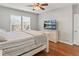 Cozy bedroom with hardwood floors and a ceiling fan at 5140 Mt Pawnee Ave, Frederick, CO 80504