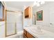 Classic bathroom featuring a walk-in shower, medicine cabinet, and vanity at 465 Indian Way, Monument, CO 80132