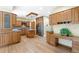 Gourmet kitchen with wood cabinetry, stainless steel appliances, granite countertops, and a center island at 465 Indian Way, Monument, CO 80132