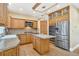 Well-appointed kitchen with wood cabinetry, stainless steel appliances, center island, and stylish design elements at 465 Indian Way, Monument, CO 80132