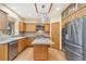 Charming kitchen featuring wood cabinets, stainless steel appliances, central island, and modern design elements at 465 Indian Way, Monument, CO 80132
