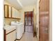 Bright laundry room featuring a utility sink, modern washer and dryer, and access to a sunroom at 465 Indian Way, Monument, CO 80132