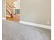 Spacious living room with carpet, neutral walls, and views into adjoining room at 465 Indian Way, Monument, CO 80132