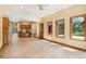 Bright and spacious living area featuring wood floors, built-in desk and cabinetry, and large windows for natural light at 465 Indian Way, Monument, CO 80132