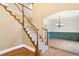 Elegant staircase with hardwood and carpet, leading to an open living space at 465 Indian Way, Monument, CO 80132