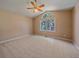 Neutral bedroom features vaulted ceilings and a bright, sunny window at 4228 Scenic Village Dr, Evergreen, CO 80439