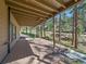 Spacious covered deck with wood flooring, perfect for outdoor entertaining and relaxation at 4228 Scenic Village Dr, Evergreen, CO 80439