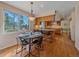 Bright kitchen features a breakfast nook, island with bar seating, and stainless steel appliances at 4228 Scenic Village Dr, Evergreen, CO 80439