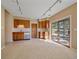 Living room features a wet bar, access to outside, and track lighting at 4228 Scenic Village Dr, Evergreen, CO 80439