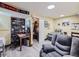 A versatile basement offers a workspace, relaxation area and a bed providing flexible options for various activities at 7872 S Hill Dr, Littleton, CO 80120