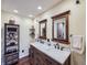 Elegant bathroom with dual sinks, modern fixtures, and a marble countertop at 7872 S Hill Dr, Littleton, CO 80120