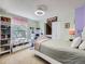 Inviting bedroom with natural light, study area, and built-in bookcase at 7872 S Hill Dr, Littleton, CO 80120