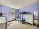 A cozy bedroom features a bunk bed, a desk and a large dresser with a mirror creating a comfortable and functional space at 7872 S Hill Dr, Littleton, CO 80120