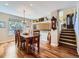 Inviting dining room with hardwood floors and staircase access at 7872 S Hill Dr, Littleton, CO 80120
