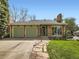 Charming single-story home featuring a brick exterior and attached two-car garage at 7872 S Hill Dr, Littleton, CO 80120