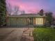 Charming single-story home featuring a brick exterior and attached two-car garage at 7872 S Hill Dr, Littleton, CO 80120
