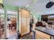 Spacious kitchen with hardwood floors, stainless steel appliances, and access to living spaces at 7872 S Hill Dr, Littleton, CO 80120