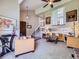 Open-concept living room with high ceilings, cozy seating, and a staircase view at 7872 S Hill Dr, Littleton, CO 80120