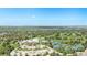 Aerial view of the community, golf course, tennis courts, and city skyline at 4301 S Pierce St # 4D, Littleton, CO 80123