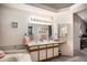 Bright bathroom with double sinks, large mirror, shower-tub combo, and neutral finishes at 4301 S Pierce St # 4D, Littleton, CO 80123