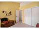 Cozy bedroom with neutral carpet, open closet and ensuite entrance with a view into the other room at 4301 S Pierce St # 4D, Littleton, CO 80123