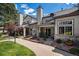 Townhouse exterior showcasing a well maintained yard, patio, and manicured landscaping at 4301 S Pierce St # 4D, Littleton, CO 80123