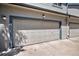 Attached two car garage with concrete driveway in a grey townhouse at 4301 S Pierce St # 4D, Littleton, CO 80123