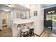 Convenient kitchenette area with breakfast bar seating and view into the dining room at 4301 S Pierce St # 4D, Littleton, CO 80123