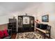 Inviting living room with a unique display cabinet, stylish decor, and a comfortable seating arrangement at 4301 S Pierce St # 4D, Littleton, CO 80123