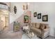 Comfortable living room with neutral decor, cozy seating and artwork leading up to the staircase at 4301 S Pierce St # 4D, Littleton, CO 80123