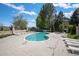 Outdoor pool area complete with lounge chairs and beautiful landscaping in a private community at 4301 S Pierce St # 4D, Littleton, CO 80123