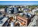 Great aerial view of neighborhood restaurants, businesses and cityscape at 1441 Central St # 203, Denver, CO 80211