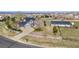 Aerial view of the property showcasing the house, detached garage, and spacious fenced yard at 29145 E 160Th Ct, Brighton, CO 80603