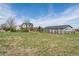 Large backyard with a well maintained lawn and a fence bordering the property at 29145 E 160Th Ct, Brighton, CO 80603